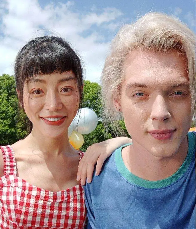 A girl and a boy's selfie using panorama mode on Redmi 10