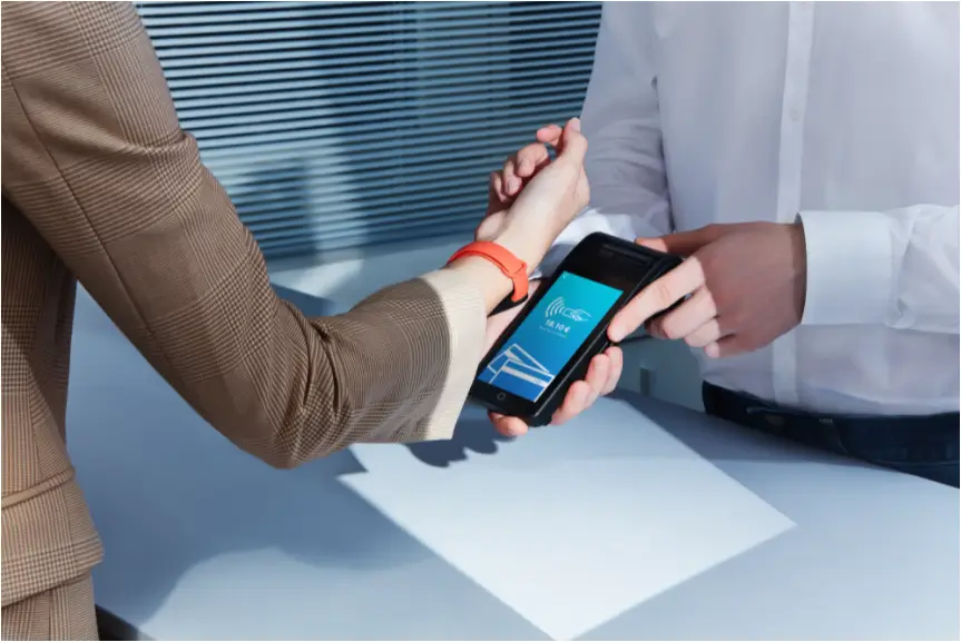 A man is scanning a girl's Mi Smart Band 6 NFC
