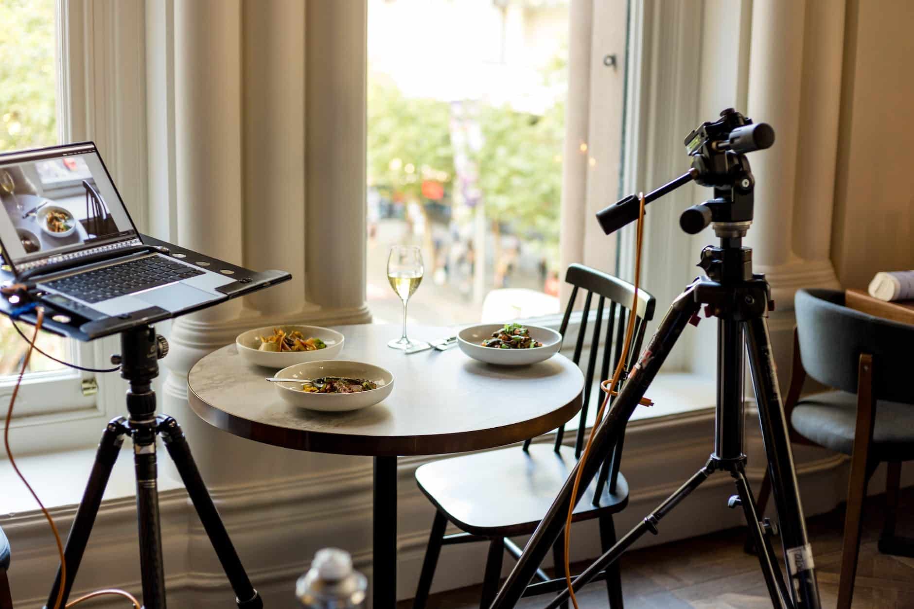 three round white bowls and clear wine glass on top of table